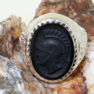 onyx silver ring on rock